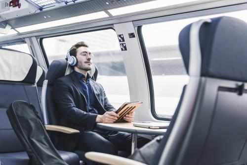 images/2020/Oct2020/28/businessman-in-train-relaxing-listening-to-music.jpg
